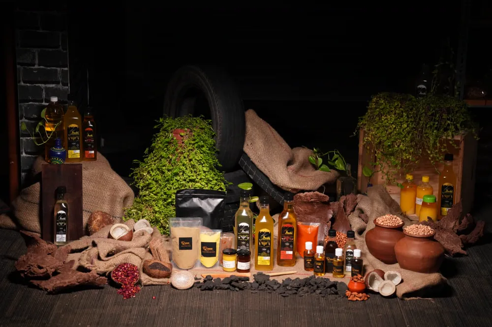 The Anshi range arranged together: oil bottles, pouches, jars and clay pots.